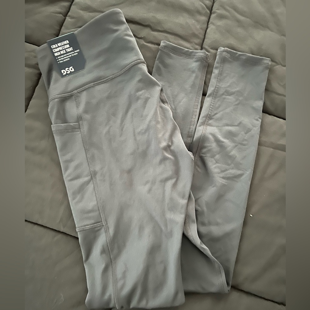 Dicks Sporting Goods legging in dark gray. Never worn with tags still on.